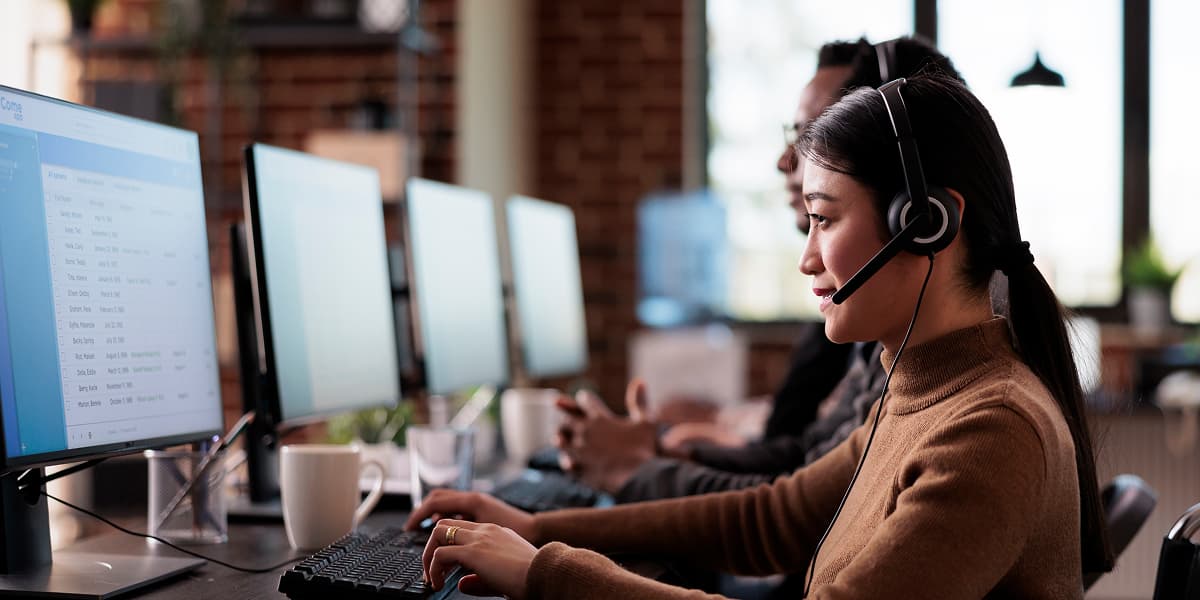 Customer support representative at desk